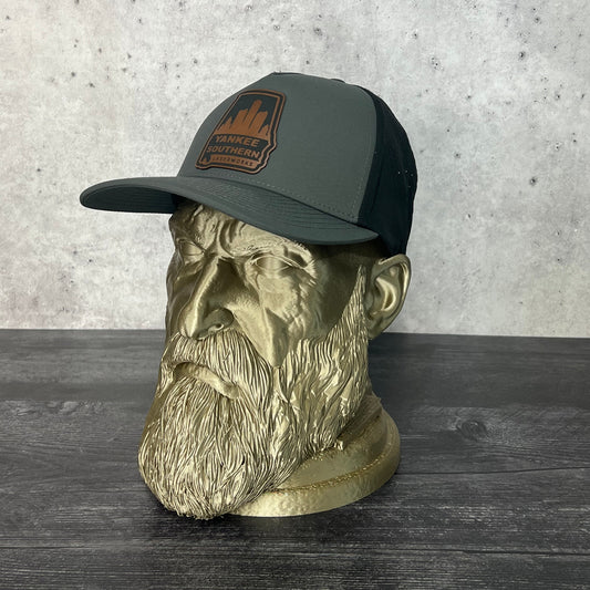Yankee Southern Laserworks 5 panel hat with walnut colored branded patch on a gold statue.