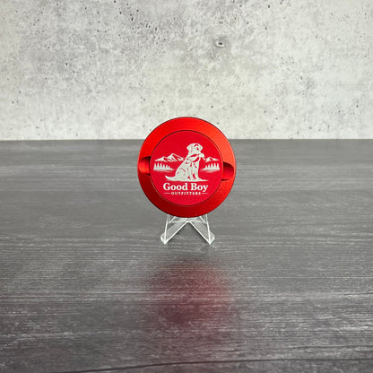 Red GBO Aluminum dip can with GBO  logo on a concrete and wooden surface