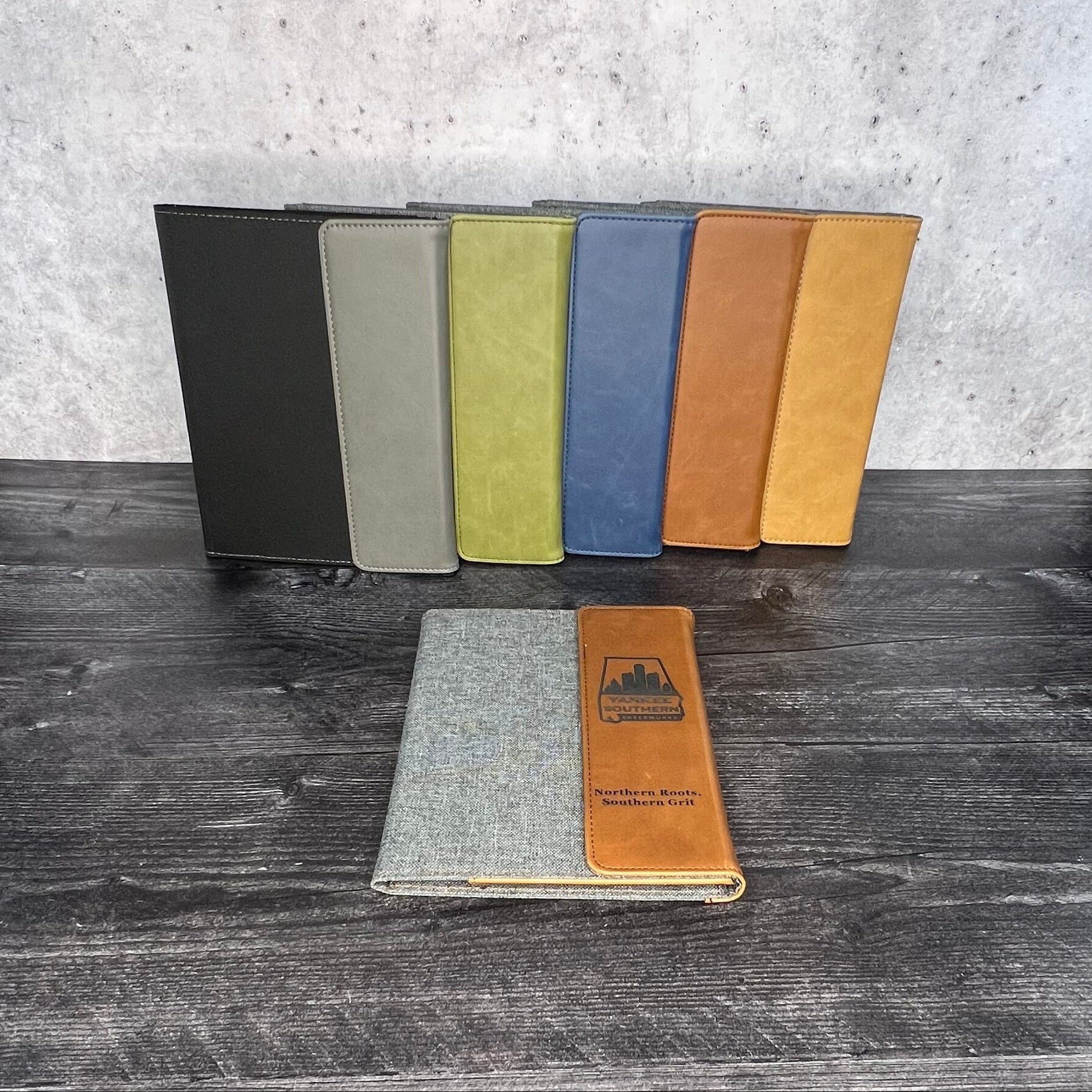 Color swatches on a wooden surface with a concrete floor in the background