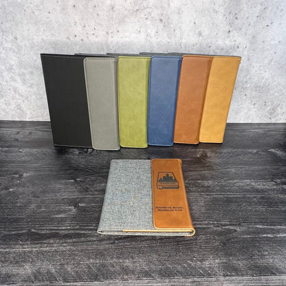 Color swatches on a wooden surface with a concrete floor in the background