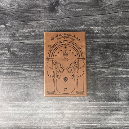 Walnut leatherette journal on a wooden floor with a concrete wall