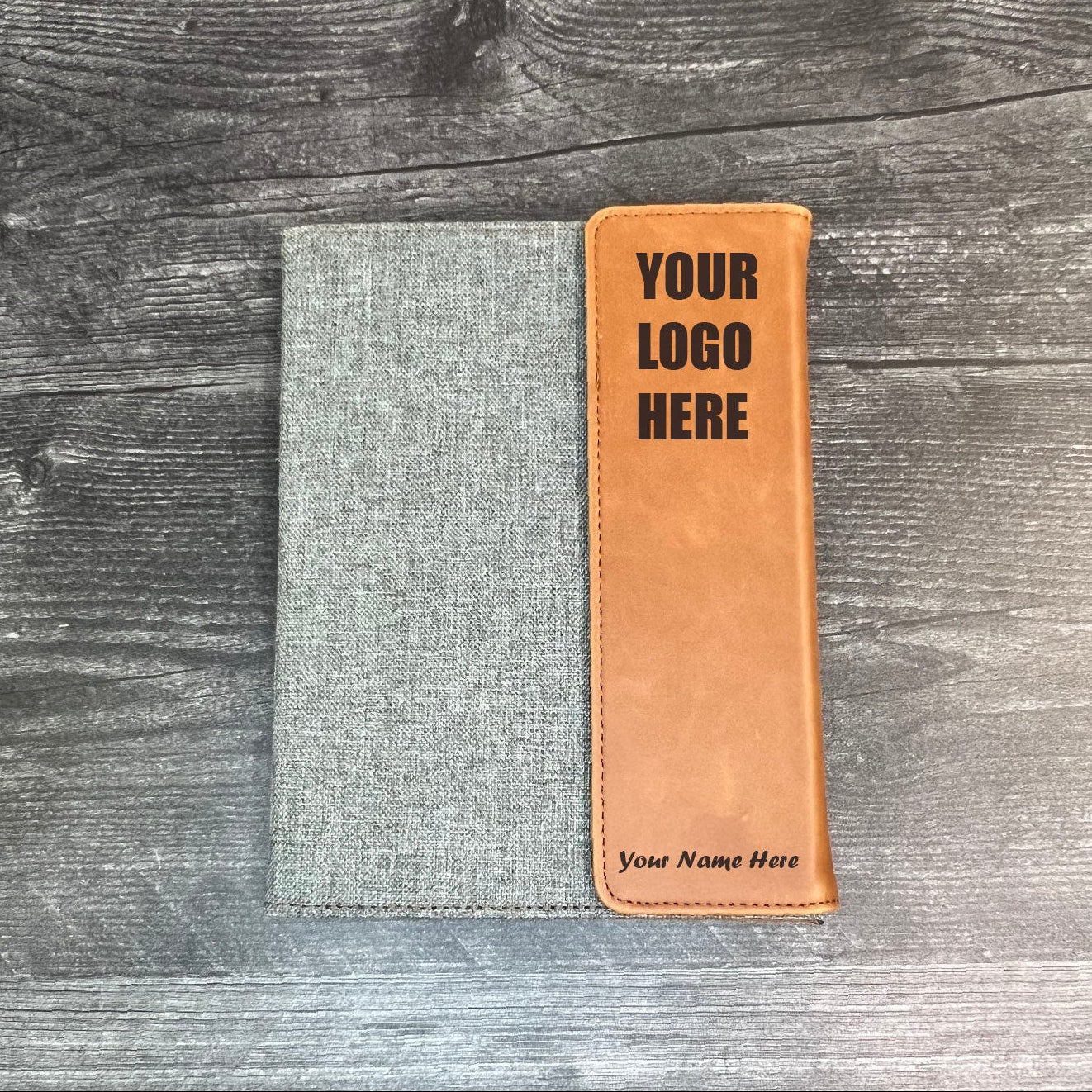 Custom laser engraved padfolio in Rawhide and gray color with crisp contrast text showcasing name and logo areas.