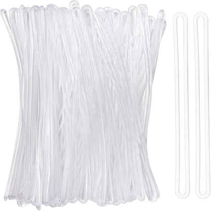 Clear plastic zip ties on a white background